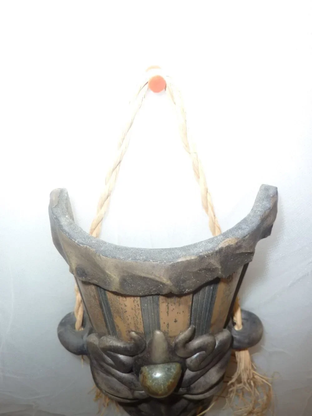 Clay mask on wood. Size 12 x 4 1/2 x 2 1/2 inches by artist Krisna Brasil